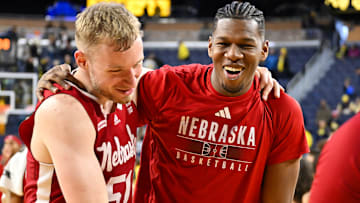 Nebraska Cornhuskers basketball players celebrate a victory