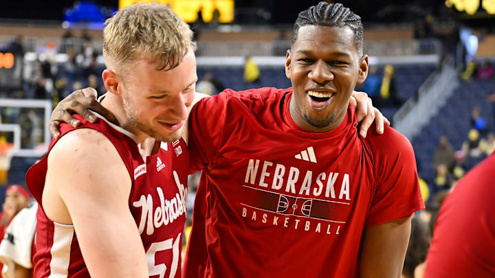 Nebraska Cornhuskers basketball players celebrate a victory