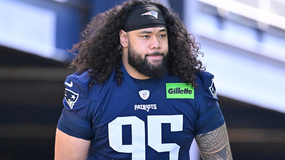 Jul 23, 2025; Foxborough, MA, USA; New England Patriots defensive tackle Khyiris Tonga (95) walks to the practice field for training camp at Gillette Stadium. Jul 23, 2025; Foxborough, MA, USA; New England Patriots defensive tackle Khyiris Tonga (95) walks to the practice field for training camp at Gillette Stadium.