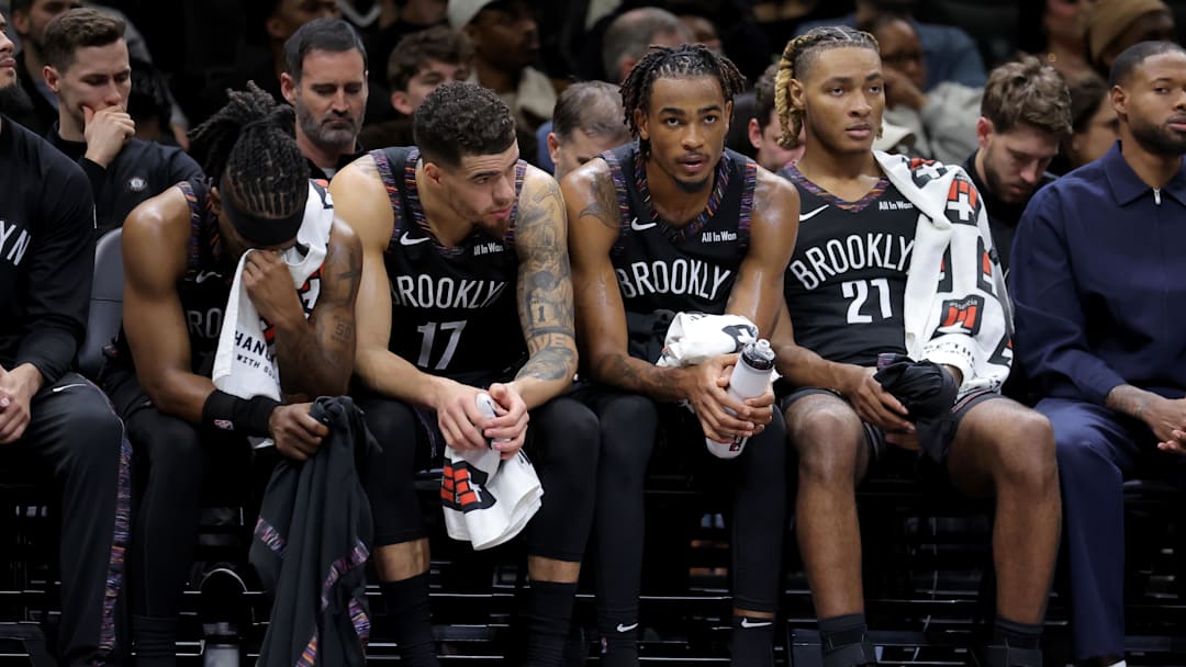 Jan 9, 2026; Brooklyn, New York, USA; Brooklyn Nets guard Terance Mann (14) and forward Michael Porter Jr. (17) and center Nic Claxton (33) and forward Noah Clowney (21) sit on the bench late during the fourth quarter against the Los Angeles Clippers at Barclays Center. Mandatory Credit: Brad Penner-Imagn Images