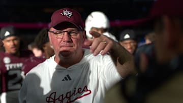Sep 30, 2024; Arlington, Texas, USA; Texas A&M Aggies coach Mike Elko points to a player after a win over the Arkansas Razorbacks in the Southwest Classic at AT&T Stadium. 