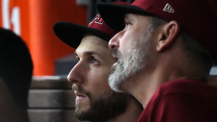 Arizona Diamondbacks starting pitcher Zac Gallen (23) speaks with manager Torey Lovullo (right) in the dugout during the sixth inning against the Texas Rangers in game one of the 2023 World Series at Globe Life Field in Arlington, Texas, on Oct. 27, 2023.