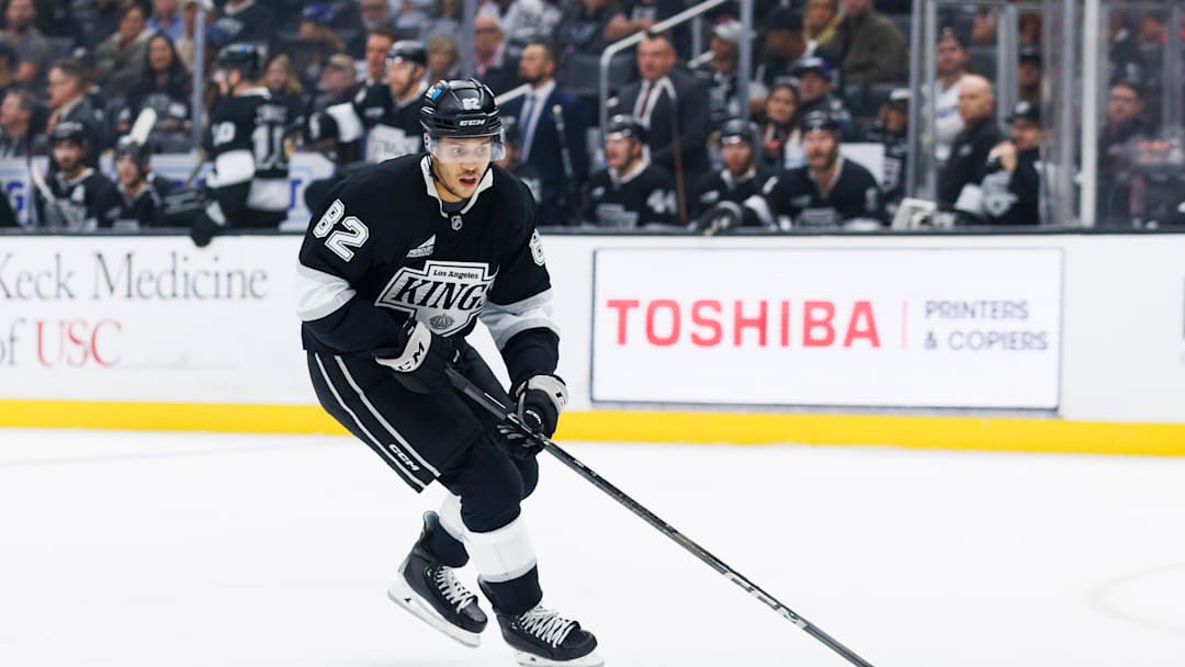 Caleb Jones skating with the puck during matchup between Utah Hockey Club v Los Angeles Kings