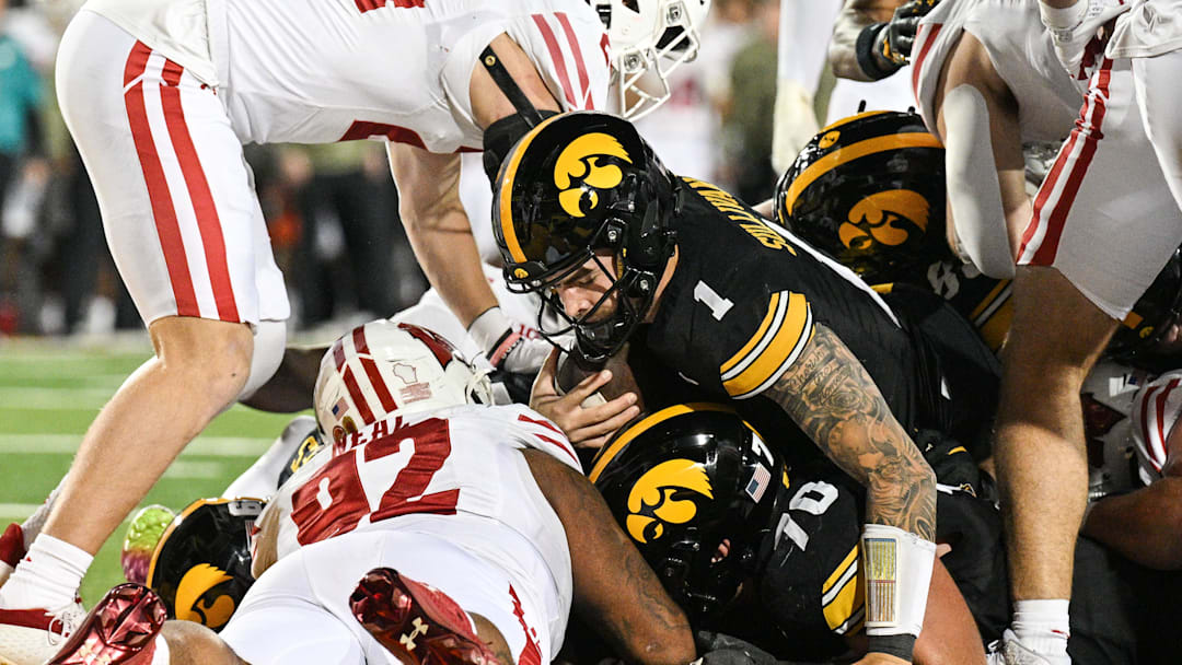 Iowa quarterback Brendan Sullivan (1) scores on a 1-yard touchdown run against Wisconsin during the second quarter at Kinnick Stadium in Iowa City, Iowa, on Nov. 2, 2024. 