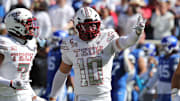Texas Tech Red Raiders defensive back Jacob Rodriguez (10) reacts after a play against the Brigham Young Cougars at Jones AT&T Stadium. 