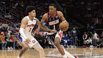 Mar 31, 2023; Houston, Texas, USA; Houston Rockets forward Jabari Smith Jr. (1) dribbles against Detroit Pistons guard Killian Hayes (7) in the first quarter at Toyota Center. Mandatory Credit: Thomas Shea-Imagn Images