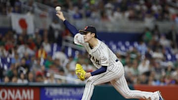 Mar 20, 2023; Miami, Florida, USA; Japan starting pitcher Roki Sasaki (14) delivers a pitch during the first inning against Mexico at LoanDepot Park. 