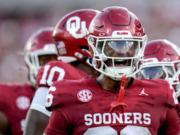 Oklahoma defensive back Kani Walker (26) yells to fans in the first half of an NCAA football game between Oklahoma (OU) and Temple at the Gaylord Family Oklahoma Memorial Stadium in Norman, Okla., on Friday, Aug. 30, 2024.