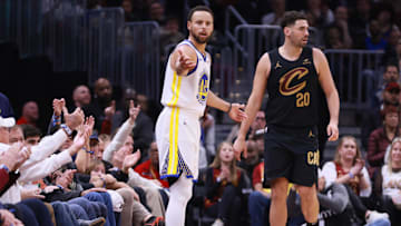 Nov 5, 2023; Cleveland, Ohio, USA; Golden State Warriors guard Steph Curry  (30) questions a call while defended by Cleveland Cavaliers guard Georges Niang (20)