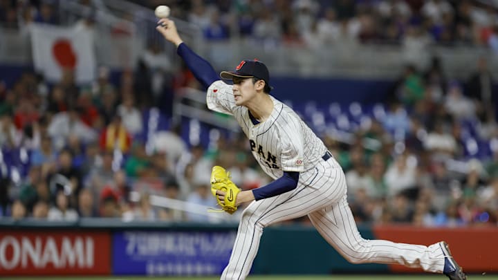 Japan starting pitcher Roki Sasaki (14) delivers a pitch during the first inning against Mexico at LoanDepot Park. Japan starting pitcher Roki Sasaki (14) delivers a pitch during the first inning against Mexico at LoanDepot Park.