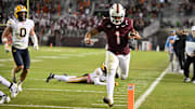 Oct 24, 2025; Blacksburg, Va.; Virginia Tech quarterback Kyron Drones (1) runs for a touchdown against California.