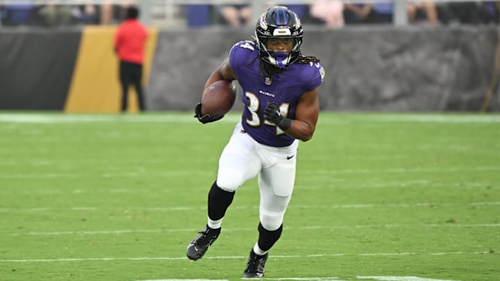 Aug 7, 2025; Baltimore, Maryland, USA; Baltimore Ravens running back Keaton Mitchell (34) runs with the ball against the Indianapolis Colts during the first quarter at M&T Bank Stadium. Mandatory Credit: Rafael Suanes-Imagn Images