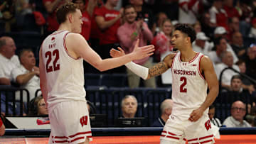 Nov 27, 2025; San Diego, CA, USA; Wisconsin Badgers guard Nick Boyd (2) reacts with Wisconsin Badgers forward Austin Rapp (22) after scoring against the Providence Friars during the second half at Jenny Craig Pavilion. Mandatory Credit: Abe Arredondo-Imagn Images