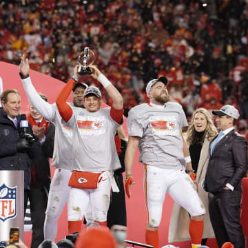 Jan 29, 2023; Kansas City, Missouri, USA; Kansas City Chiefs head coach Andy Reid and Clark Hunt and defensive end Carlos Dunlap (8) and tight end Travis Kelce (87) and quarterback Patrick Mahomes (15) and general manager Brett Veatch celebrate after winning the AFC Championship game against the Cincinnati Bengals at GEHA Field at Arrowhead Stadium. Mandatory Credit: Denny Medley-USA TODAY Sports