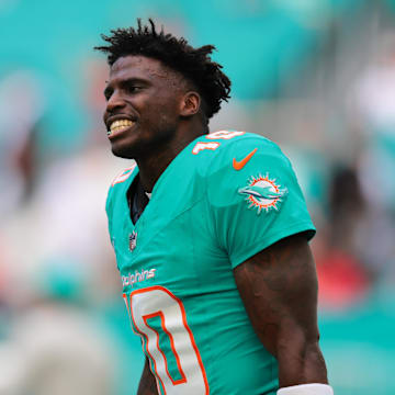 Dec 22, 2024; Miami Gardens, Florida, USA; Miami Dolphins wide receiver Tyreek Hill (10) reacts on the field before the game against the San Francisco 49ers at Hard Rock Stadium. Mandatory Credit: Sam Navarro-Imagn Images