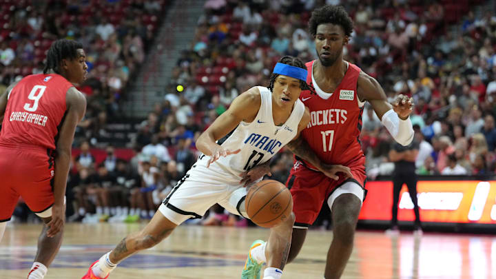 Jul 7, 2022; Las Vegas, NV, USA; Orlando Magic guard RJ Hampton (13) dribbles against Houston Rockets forward Tari Eason (17) during an NBA Summer League game at T&M. Mandatory Credit: Stephen R. Sylvanie-Imagn Images