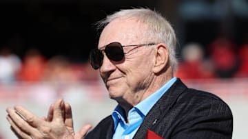 Nov 16, 2024; Fayetteville, Arkansas, USA; Dallas Cowboys owner and member of the 1964 Arkansas Razorbacks National Championship team, Jerry Jones, claps as the team is honored during the first half against the Texas Longhorns at Donald W. Reynolds Razorback Stadium. Mandatory Credit: Nelson Chenault-Imagn Images