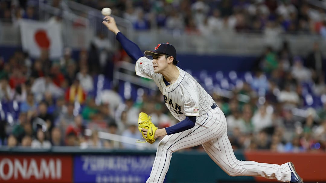 Mar 20, 2023; Miami, Florida, USA; Japan starting pitcher Roki Sasaki (14) delivers a pitch during the first inning against Mexico at LoanDepot Park. Mandatory Credit: Sam Navarro-Imagn Images