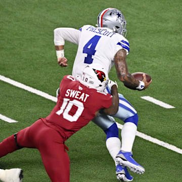 Arizona Cardinals linebacker Josh Sweat sacks Dallas Cowboys quarterback Dak Prescott in the first half at AT&T Stadium. 