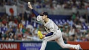 Mar 20, 2023; Miami, Florida, USA; Japan starting pitcher Roki Sasaki (14) delivers a pitch during the first inning against Mexico at LoanDepot Park. 