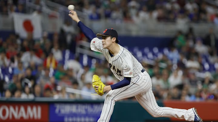 Mar 20, 2023; Miami, Florida, USA; Japan starting pitcher Roki Sasaki (14) delivers a pitch during the first inning against Mexico at LoanDepot Park.