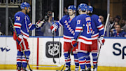 Apr 17, 2025; New York, New York, USA;  New York Rangers left wing Chris Kreider (20) celebrates with his teammates after scoring a goal in the third period against the Tampa Bay Lightning at Madison Square Garden. Mandatory Credit: Wendell Cruz-Imagn Images