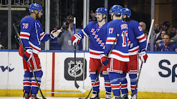 Apr 17, 2025; New York, New York, USA;  New York Rangers left wing Chris Kreider (20) celebrates with his teammates after scoring a goal in the third period against the Tampa Bay Lightning at Madison Square Garden. Mandatory Credit: Wendell Cruz-Imagn Images