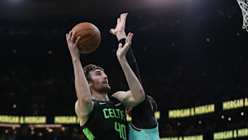 Apr 13, 2025; Boston, Massachusetts, USA; Boston Celtics center Luke Kornet (40) shoots during the first half against the Charlotte Hornets at TD Garden. Mandatory Credit: Paul Rutherford-Imagn Images