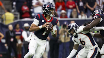 Dec 3, 2023; Houston, Texas, USA; Houston Texans quarterback C.J. Stroud (7) rolls out of the pocket on a play during the fourth quarter against the Denver Broncos at NRG Stadium. Mandatory Credit: Troy Taormina-Imagn Images