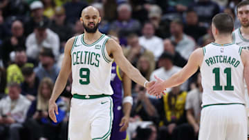 Mar 12, 2024; Salt Lake City, Utah, USA; Boston Celtics guard Derrick White (9) slaps hands with Boston Celtics guard Payton Pritchard (11) after being fouled by the Utah Jazz during the fourth quarter at Delta Center. Mandatory Credit: Rob Gray-Imagn Images