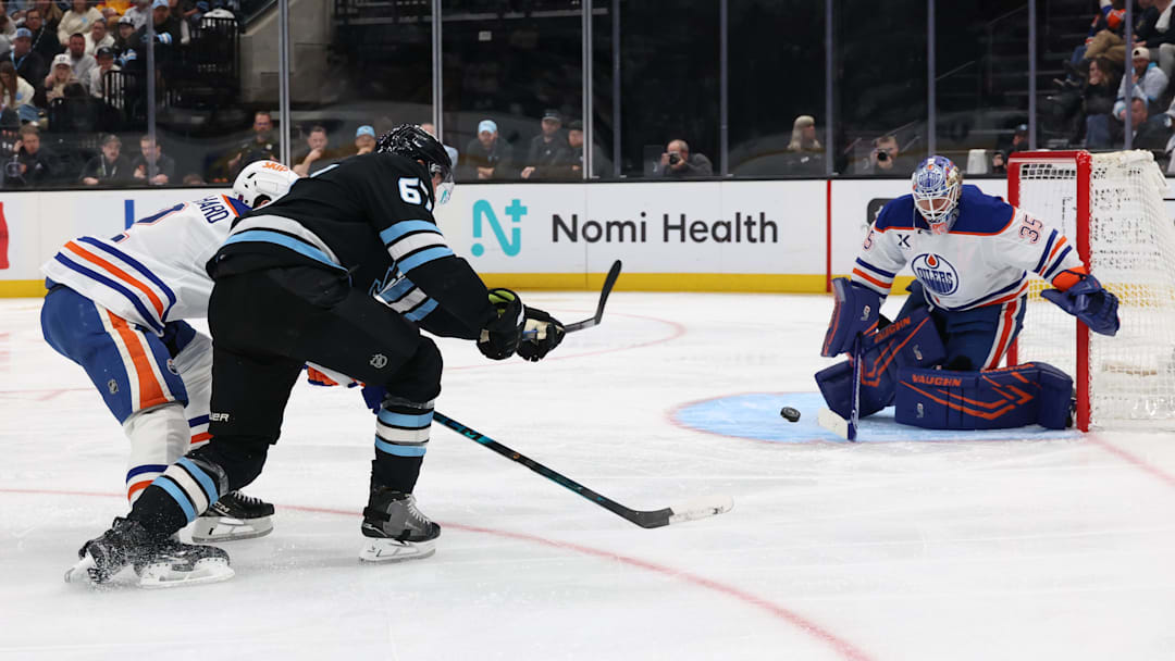 Mar 24, 2026; Salt Lake City, Utah, USA; Edmonton Oilers goaltender Tristan Jarry (35) blocks a shot by Utah Mammoth left wing Lawson Crouse (67) during the third period at Delta Center. Mandatory Credit: Rob Gray-Imagn Images