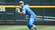 Jun 14, 2025; Omaha, Neb, USA;  UCLA Bruins shortstop Roch Cholowsky (1) completes a double play against the Murray State Racers during the second inning at Charles Schwab Field. Mandatory Credit: Steven Branscombe-Imagn Images