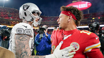 Nov 29, 2024; Kansas City, Missouri, USA; Kansas City Chiefs quarterback Patrick Mahomes (15) greets Las Vegas Raiders defensive end Maxx Crosby (98) after the game at GEHA Field at Arrowhead Stadium. Mandatory Credit: Denny Medley-Imagn Images