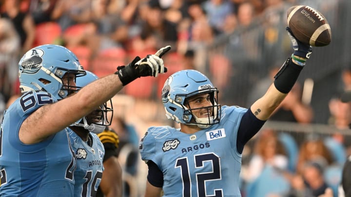 Jun 18, 2023; Toronto, Ontario, CAN;  Toronto Argonauts quarter Chad Kelly (2) celebrates after scoring a touchdown against the Hamilton Tiger-Cats in the second quarter at BMO Field. Mandatory Credit: Dan Hamilton-USA TODAY Sports