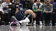 Oct 24, 2024; Dallas, Texas, USA; Dallas Mavericks guard Luka Doncic (77) falls to the floor with a possible lower body injury during the second quarter against the San Antonio Spurs at the American Airlines Center. Mandatory Credit: Jerome Miron-Imagn Images
