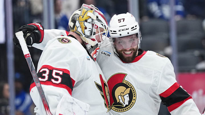 Apr 29, 2025; Toronto, Ontario, CAN; Ottawa Senators left wing David Perron (57) celebrates with goaltender Linus Ullmark (35) after defeating the Toronto Maple Leafs during game five of the first round of the 2025 Stanley Cup Playoffs at Scotiabank Arena. Mandatory Credit: Nick Turchiaro-Imagn Images