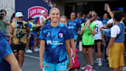 San Diego Wave FC forward Alex Morgan walks onto the pitch for her final game
