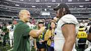 Dec 4, 2021; Arlington, TX, USA; Baylor Bears head coach Dave Aranda laughs with defensive tackle Siaki Ika (62) after the game against the Oklahoma State Cowboys in the Big 12 Conference championship game at AT&T Stadium. Mandatory Credit: Kevin Jairaj-Imagn Images