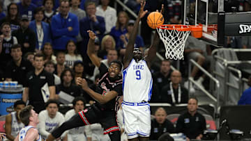 Apr 5, 2025; San Antonio, TX, USA; Duke Blue Devils center Khaman Maluach (9) shoots the ball over Houston Cougars forward Ja'Vier Francis (5) during the second half in the semifinals of the men's Final Four of the 2025 NCAA Tournament at Alamodome. Mandatory Credit: Scott Wachter-Imagn Images
