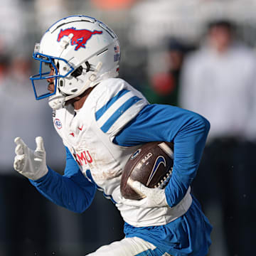 Dec 21, 2024; University Park, Pennsylvania, USA; Southern Methodist Mustangs running back Brashard Smith (1) carries the ball during the second half against the Penn State Nittany Lions at Beaver Stadium. Mandatory Credit: Vincent Carchietta-Imagn Images