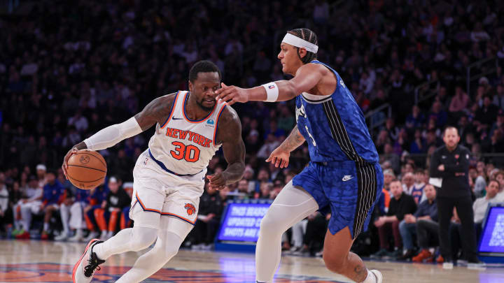 Jan 15, 2024; New York, New York, USA; New York Knicks forward Julius Randle (30) dribbles against Orlando Magic forward Paolo Banchero (5) during the second half at Madison Square Garden. Mandatory Credit: Vincent Carchietta-USA TODAY Sports