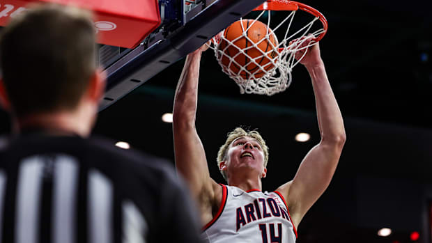 Arizona center Motiejus Krivas (14) dunks the ball against Canisius during the Wildcats' season-opening win.