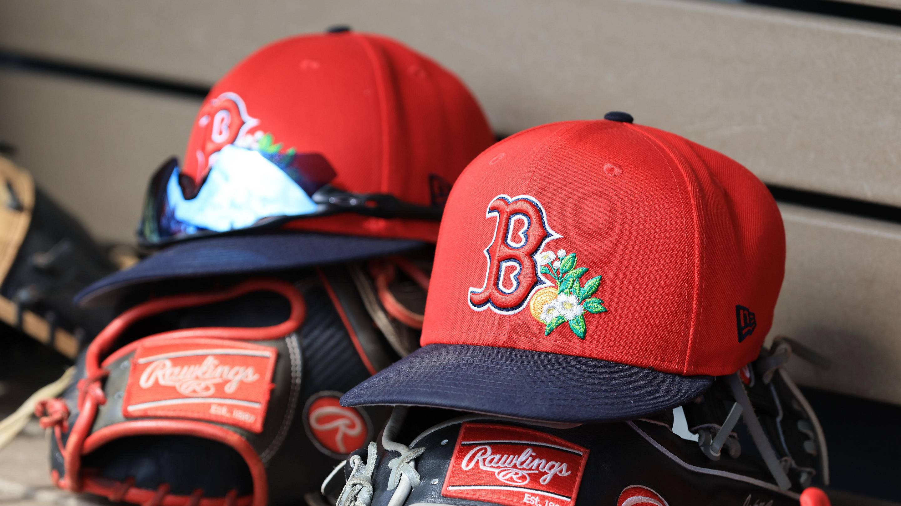 Mar 2, 2026; Dunedin, Florida, USA; A detail view of Boston Red Sox hats and gloves during the first inning against the Boston Red Sox at TD Ballpark.