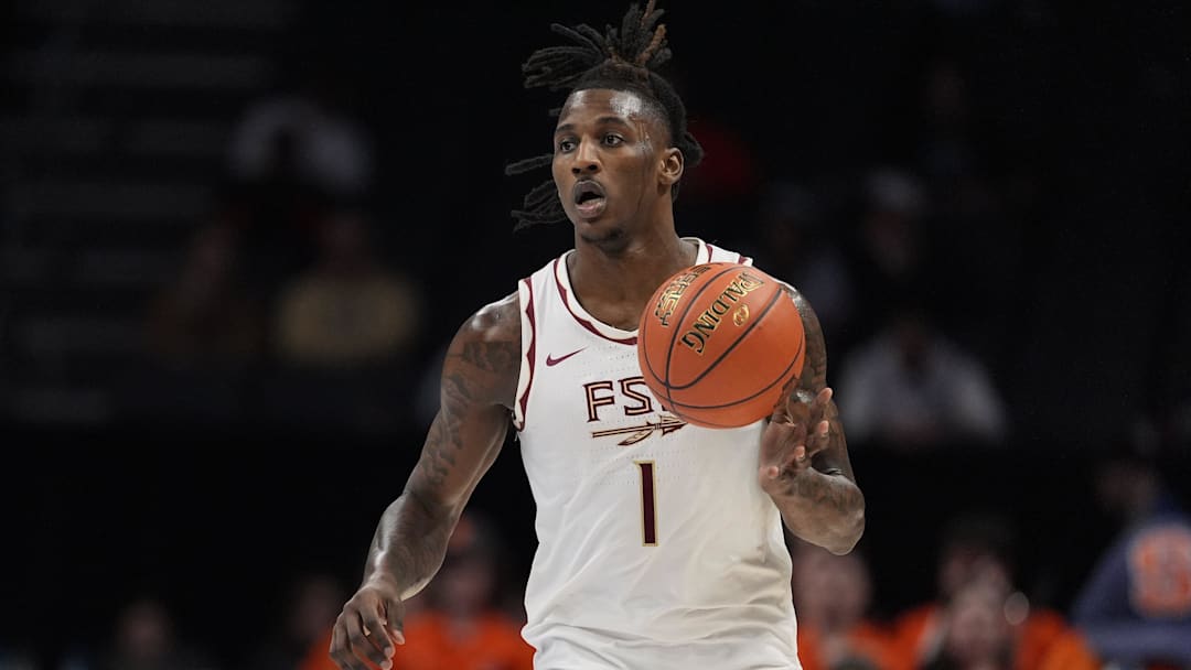 Mar 11, 2025; Charlotte, NC, USA; Florida State Seminoles guard Jamir Watkins (1) brings the ball up court against the Syracuse Orange during the second half at Spectrum Center. Mandatory Credit: Jim Dedmon-Imagn Images