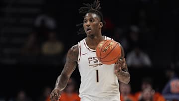 Mar 11, 2025; Charlotte, NC, USA; Florida State Seminoles guard Jamir Watkins (1) brings the ball up court against the Syracuse Orange during the second half at Spectrum Center. Mandatory Credit: Jim Dedmon-Imagn Images