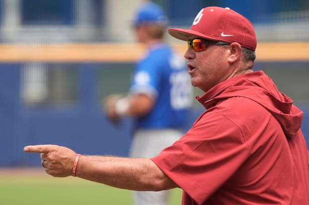 Oklahoma head coach Skip Johnson successfully argues a call with home plate umpire Eric Goshay during the game with Kentucky.