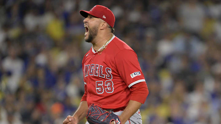 Jun 21, 2024; Los Angeles, California, USA;  Los Angeles Angels relief pitcher Carlos Estevez (53) reacts after striking out Los Angeles Dodgers second baseman Gavin Lux (9) in the 10th inning earning a save in the game at Dodger Stadium. Mandatory Credit: Jayne Kamin-Oncea-USA TODAY Sports