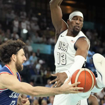 Aug 8, 2024; Paris, France; Serbia point guard Vasilije Micic (22) passes the ball while defended by United States centre Bam Adebayo (13) during the first half in a men's basketball semifinal game during the Paris 2024 Olympic Summer Games at Accor Arena. Mandatory Credit: Kyle Terada-USA TODAY Sports