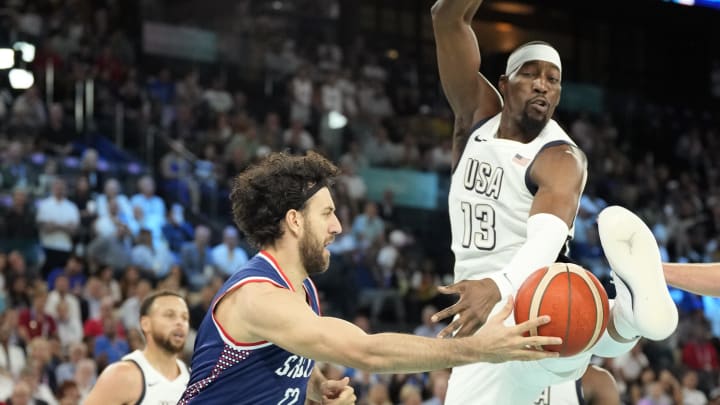 Aug 8, 2024; Paris, France; Serbia point guard Vasilije Micic (22) passes the ball while defended by United States centre Bam Adebayo (13) during the first half in a men's basketball semifinal game during the Paris 2024 Olympic Summer Games at Accor Arena. Mandatory Credit: Kyle Terada-USA TODAY Sports