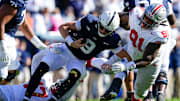 Penn State quarterback Beau Pribula (9) gets tackled during a game with Ohio State in November.  